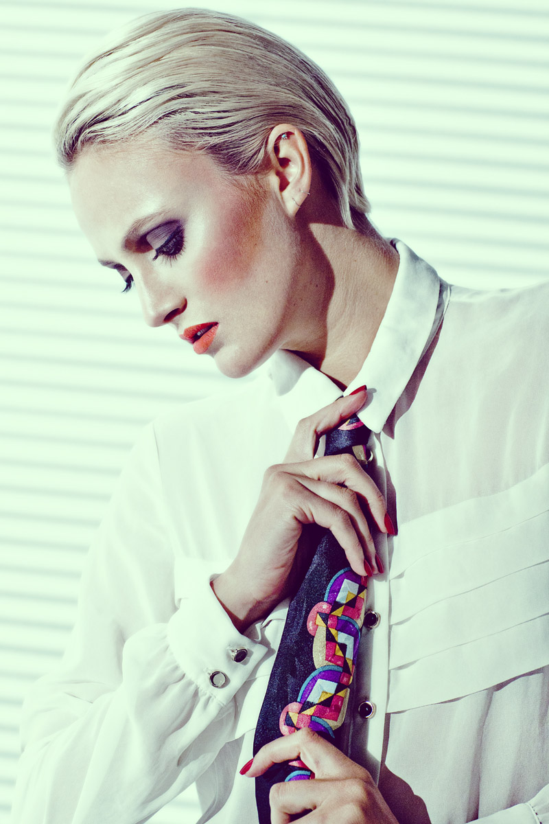 White paneled chiffon blouse, men's black geometric patterned tie