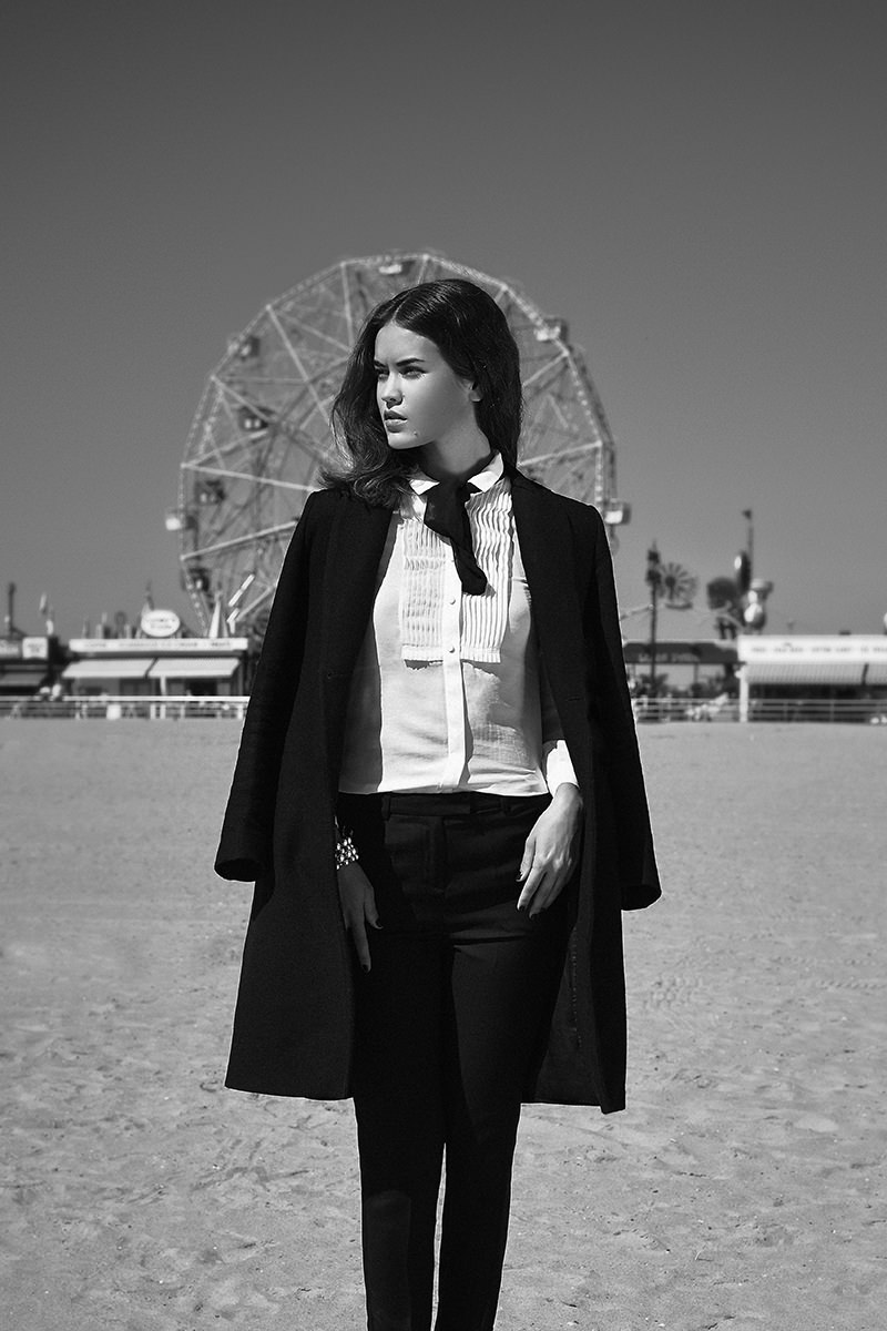 Black Pants: Alexander McQueen, Black Overcoat: Thierry Mugler, White Shirt: Ralph Lauren, Black Scarf: Maje, Pearls Bracelets: Thomas Sabo