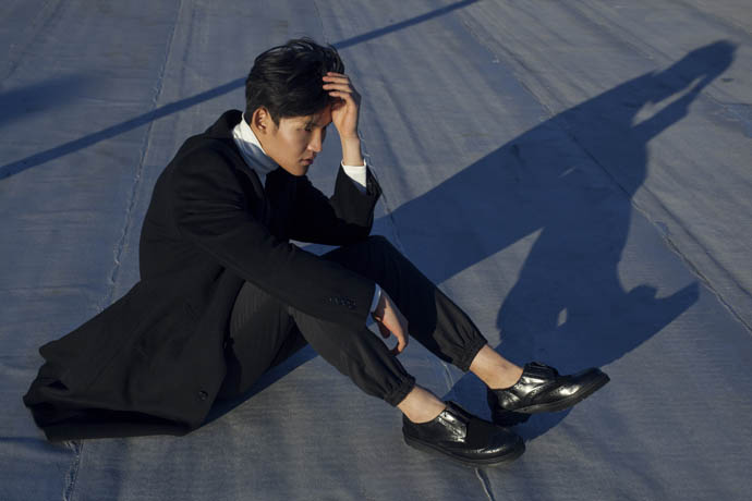 Coat by Paul Smith -Trousers by Chalayan - High neck jumper by Acne Studios - Shoes by Givenchy 