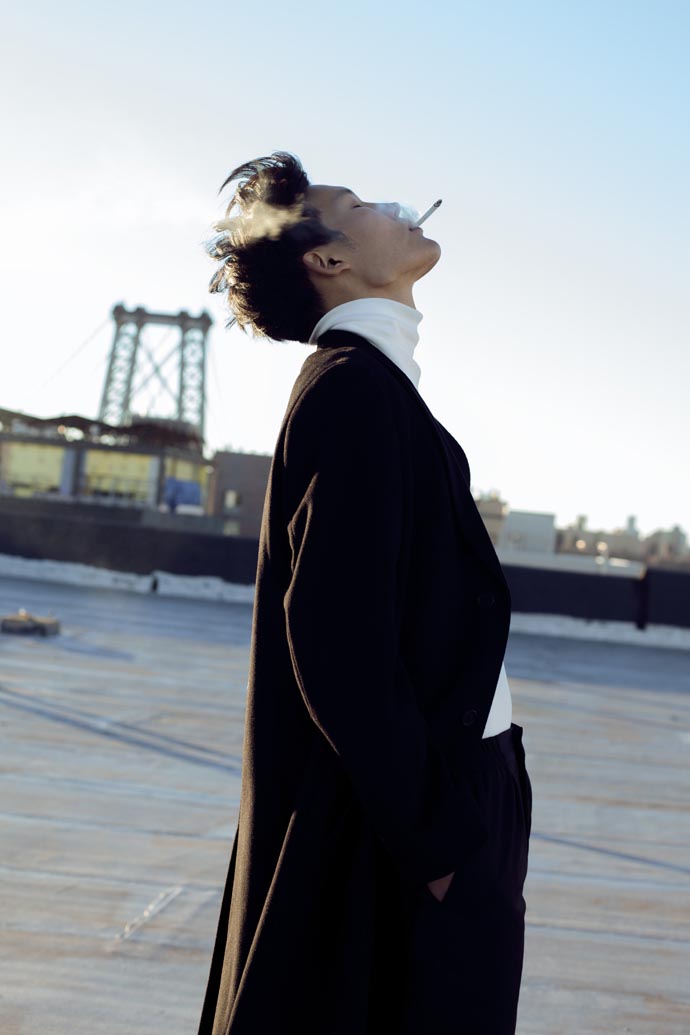 Coat by Paul Smith -Trousers by Chalayan - High neck jumper by Acne Studios - Shoes by Givenchy 