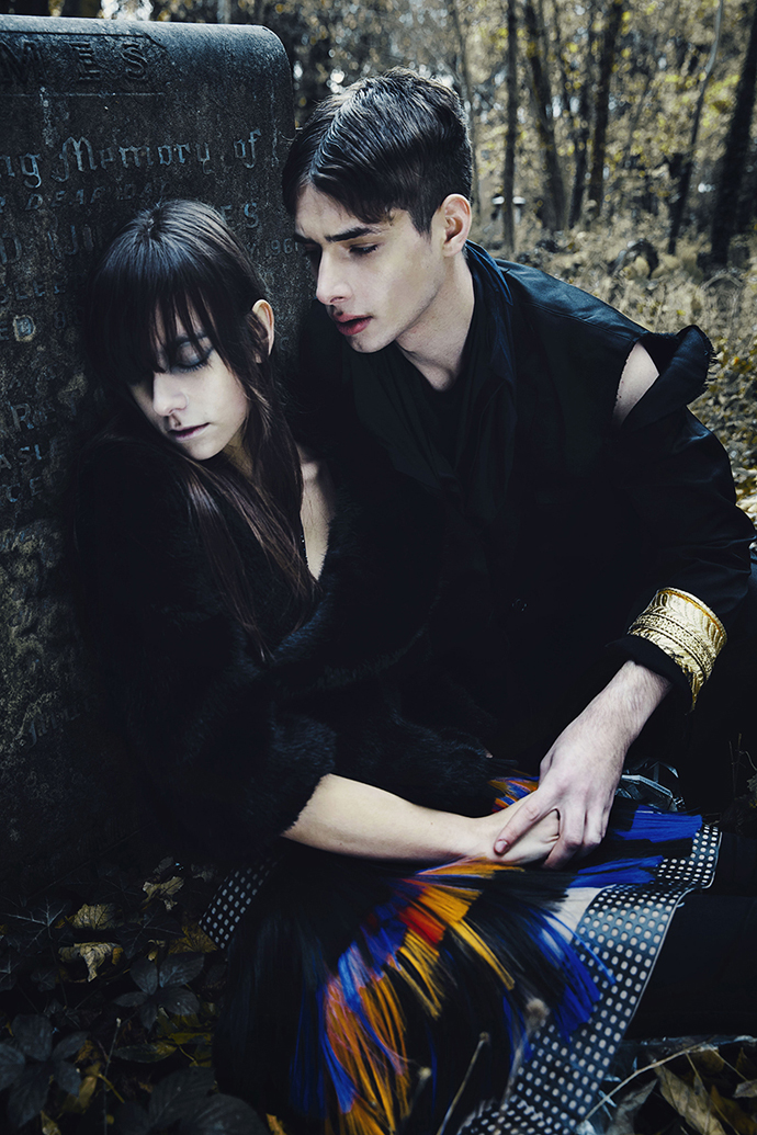 Amy wearing Faux fur coat by MINGJANET Skirt by Krasimira Stoyneva Owen wearing T-shirt (use as scarf) & Coat by Louisa Pang Sleeve Cuff by National Theatre Trousers by Hiroshi Goto