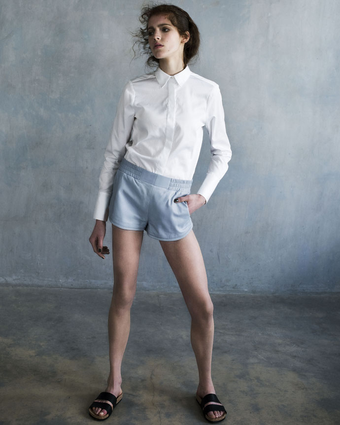 White cotton blouse Avelon, leather shorts Stand, sandals Monki, silver earrings Chan Luu 