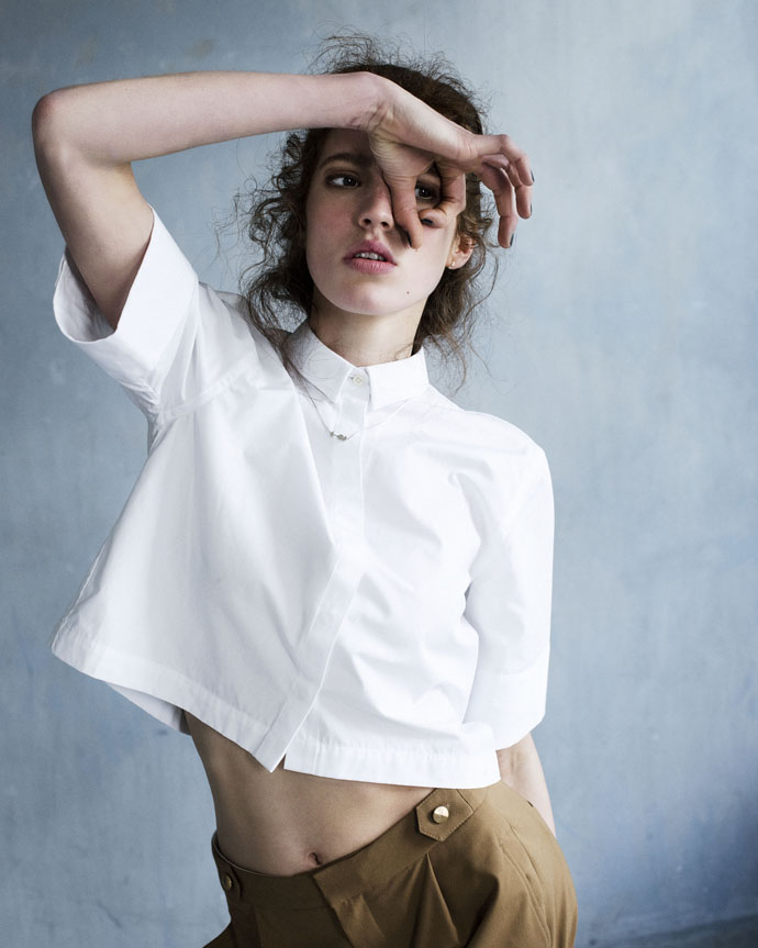 white crop blouse Won Hundred, pleated trousers Gestuz, silver earrings The Boyscouts