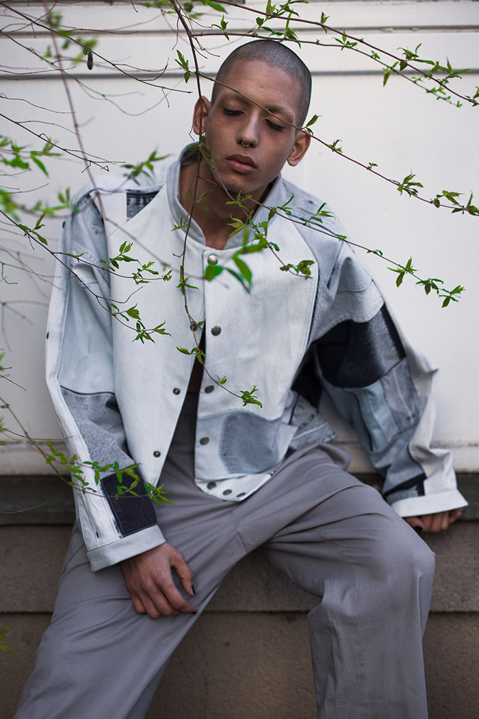Thiago wears jacket by Fade Out Label and trousers by KATKOVTA
