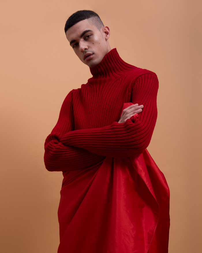 Malik wears Sweater Michael Kors, Skirt Lanvin