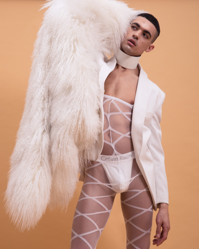 Malik wears Lingerie Leg Avenue, Blazer Tom Ford, Fur Adrienne Landau, Thong Calvin Klein