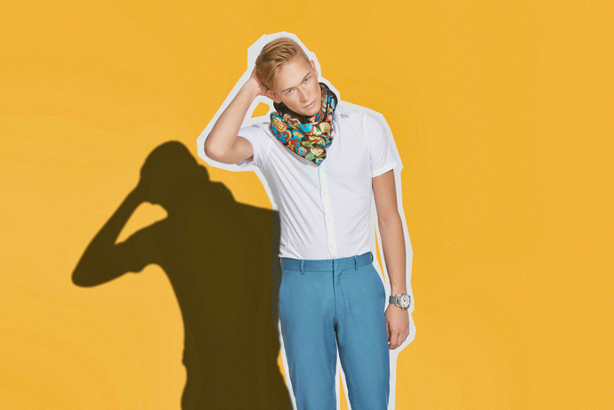 Curtis is wearing Scarf: Louis Vuitton, Shirt: Topshop, Pants: Topshop, Watch: Diesel