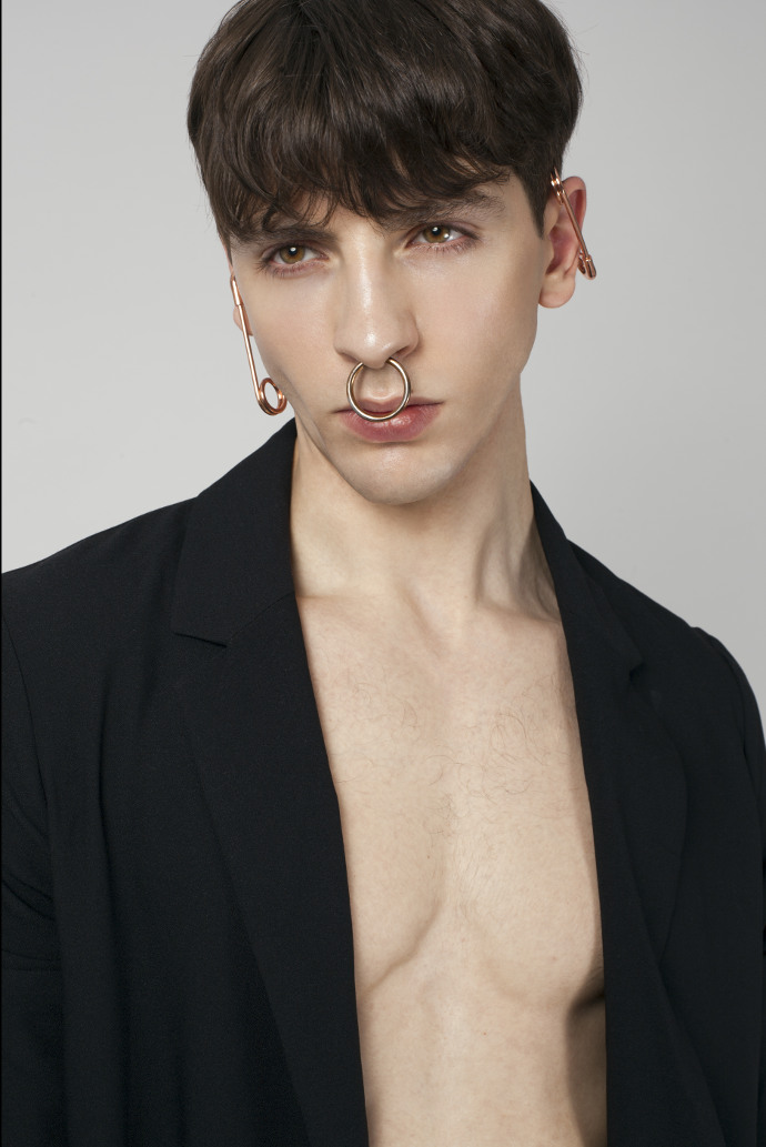 Gabriel is wearing trench by COS and accessories by Renard