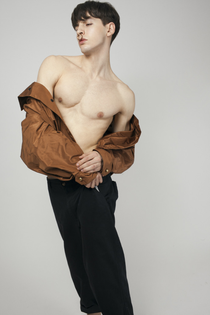 Gabriel is wearing jacket by Atu Body Couture, pants Aiezen and earring by Renard