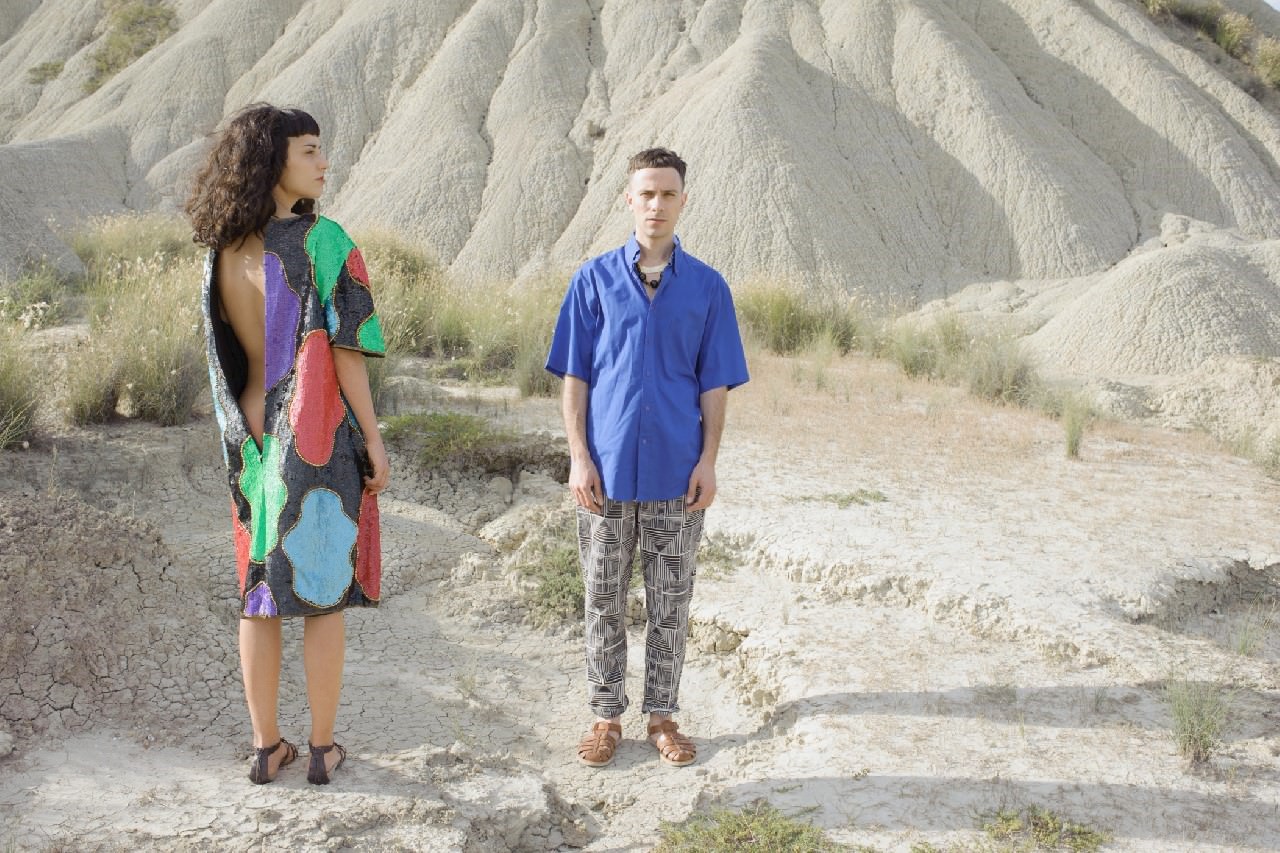 Cyen wears: dress Vintage, shoes model’s own. Alfredo wears: Cyen’s jewels, shirt YSL Vintage, trousers and shoes model’s own.