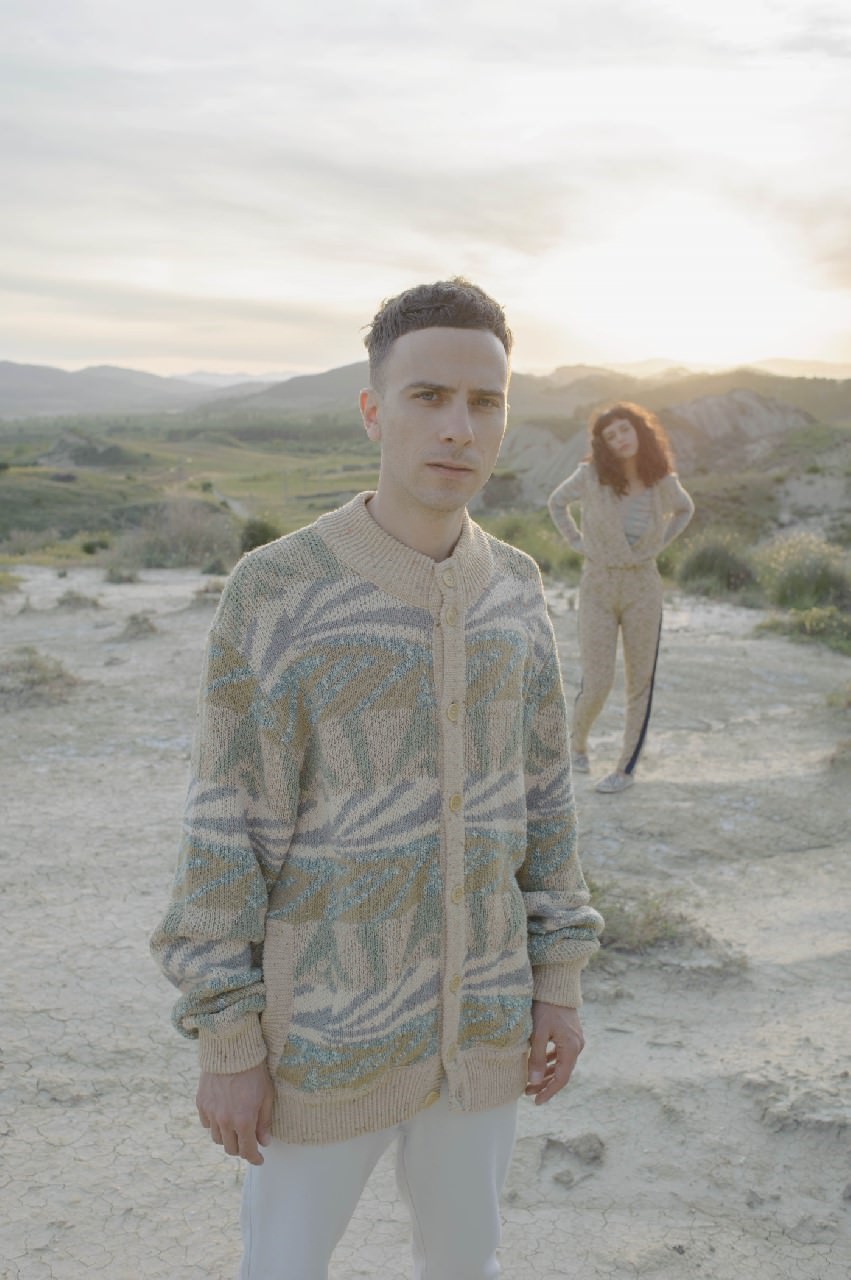 Cyen wears: top Missoni Vintage, jumpsuit and shoes model’s own. Alfredo wears: sweater Missoni Vintage, trousers stylist’s own.