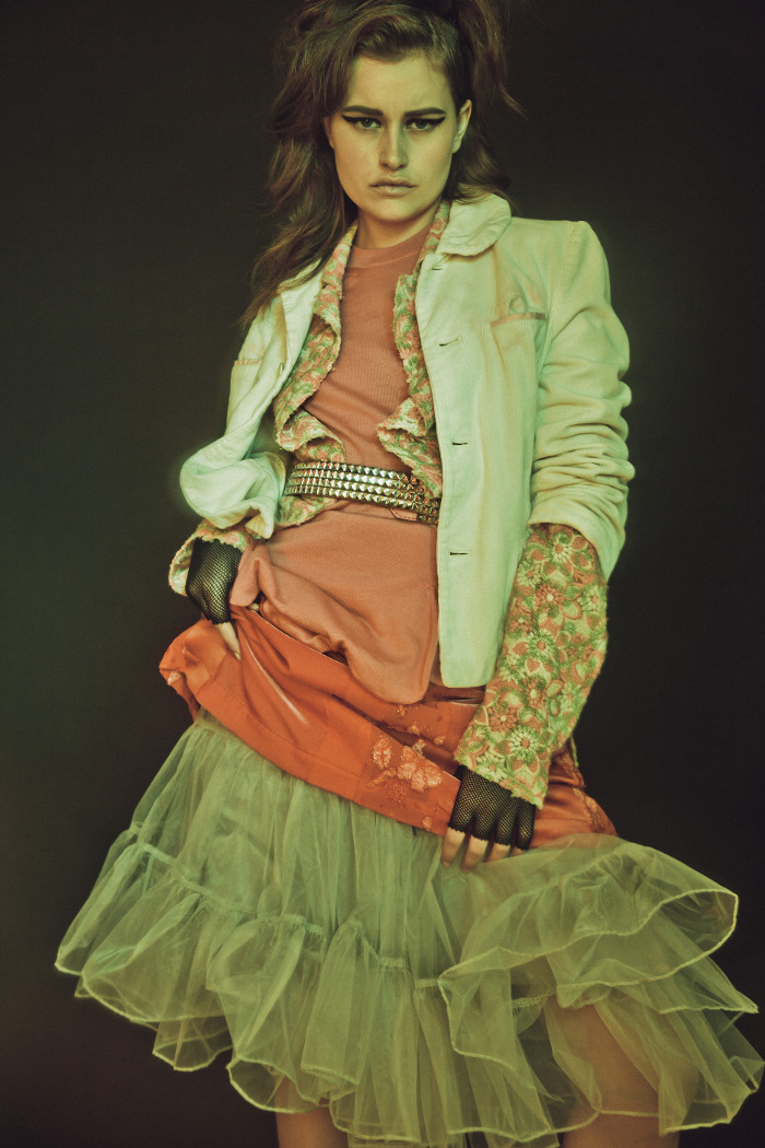  corduroy jacket, embroidered top, wool sleeveless sweater, velvet/brocade skirt, all CommeDesGarcons, crinoline petticoat Betsey Johnson, studded belt and fishnet fingerless glove Trash and Vaudeville 