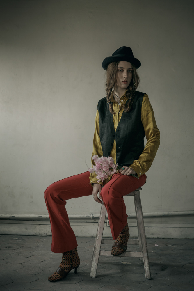  Gold shirt by Coppelia Pique Classic gilet by Hugo Boss Red flare pants - Stylist’s own Hat by Laurence Bossion Necklace, rings by Harpo Boots - Stylist’s own