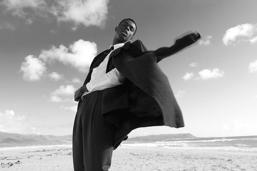 Shirt by Kenzo, Suit by River Island, Tie by Zara, Tie clip by Topman, Coat by Tiger of Sweden 