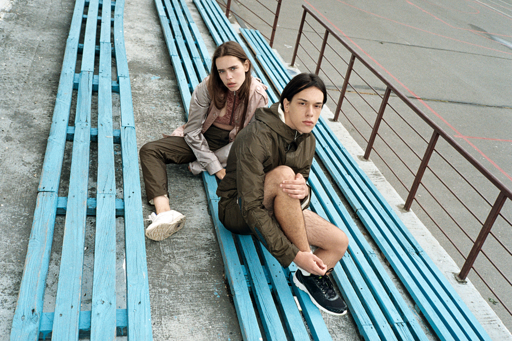 HER - Jacket, Top & Bottoms by Sasha Kanevski Shoes by Nike HIM - Jacket & Shorts by Sasha Kanevski Shoes by New Balance