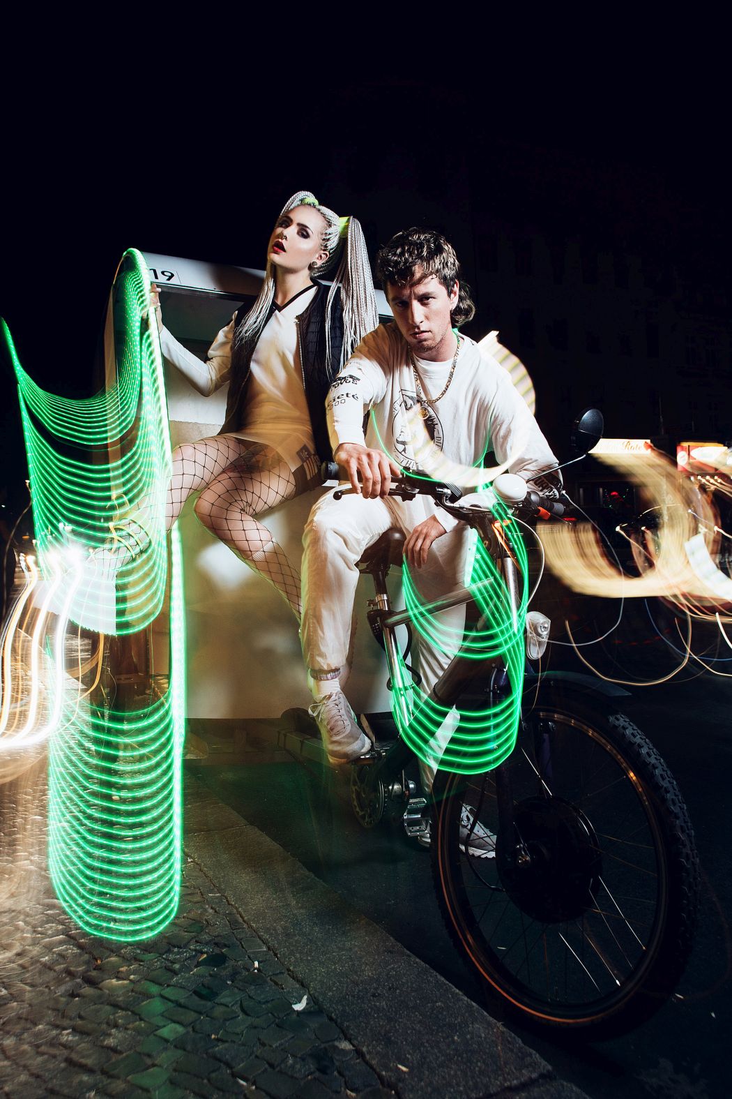 Mimi Dress by Adidas Originals / models own Fishnet, socks and vest stylist‘s own Plateaushoes by Y.R.U. Baron Pants by tHERAPY Recycle & Exorcise Longsleeve & necklace stylist‘s own T-Shirt vintage / Diesel Sneakers by Nike / models own