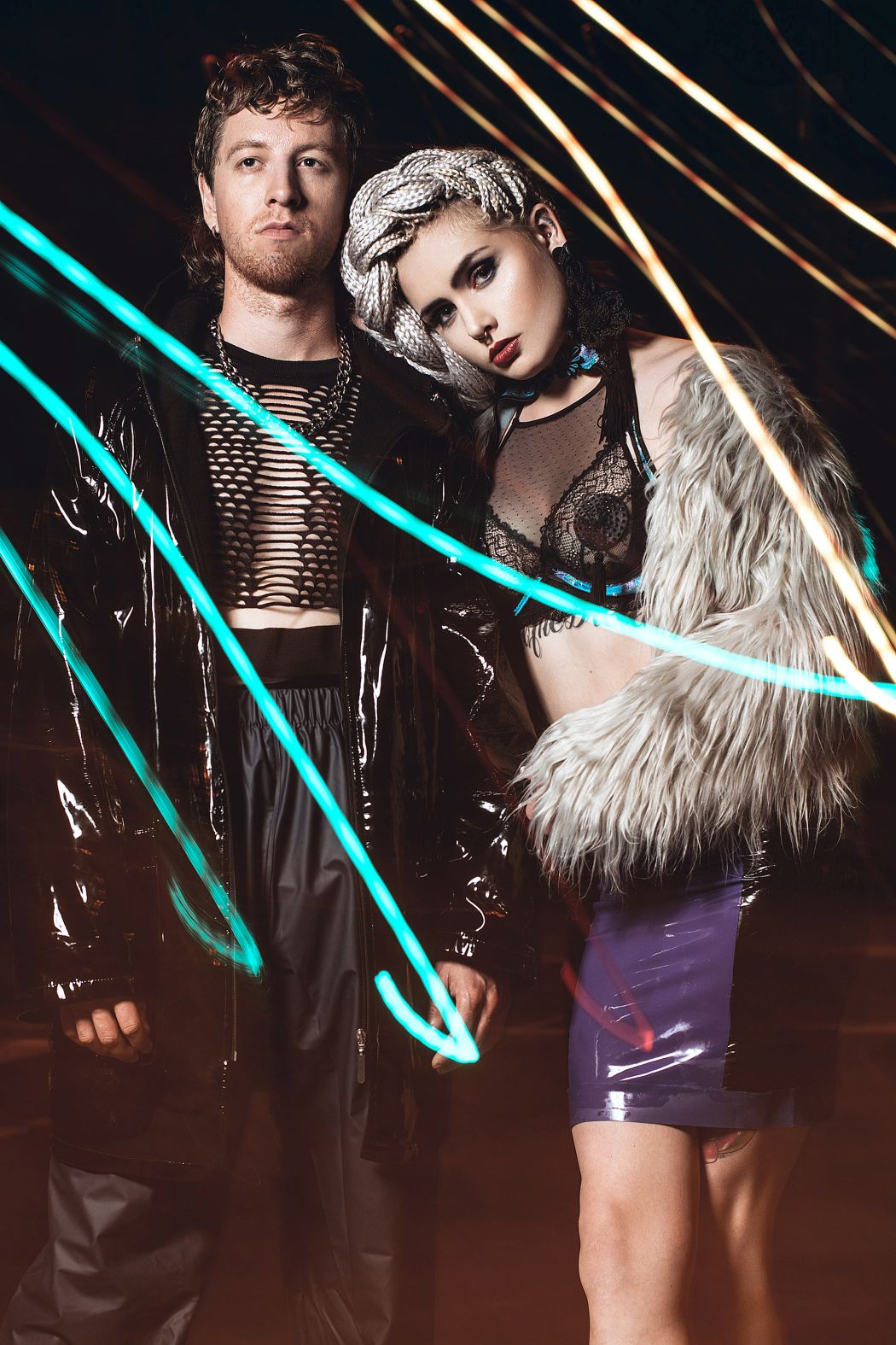 Baron Raincoat, pants & pullover stylist‘s own Necklace by ASOS Mimi Bra & nipple pasties stylist‘s own Corsage by tHERAPY Recycle & Exorcise Latexskirt by Pitchblack Latex Fakefurjacket models own Earring stylist‘s own